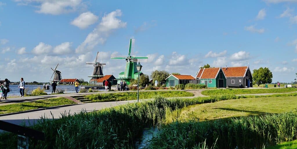 Zaanse Schans is a traditional village located near Amsterdam, offering a picturesque view of Dutch life in the past with windmills, wooden houses, and unique culture.